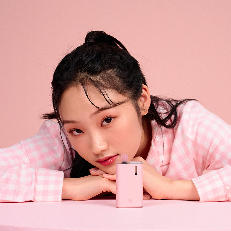 Asmon-displayed-on-the-table-behind-a-beautiful-Oriental-lady-with-her-hands-on-the-table